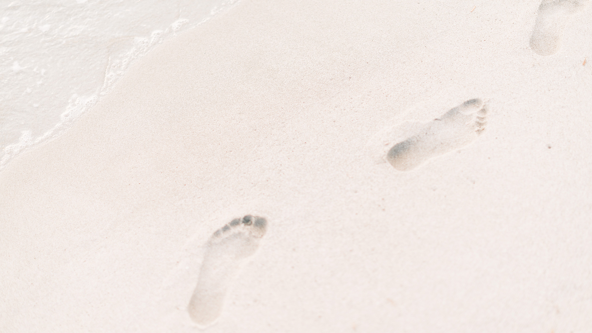 foot-steps-on-sand