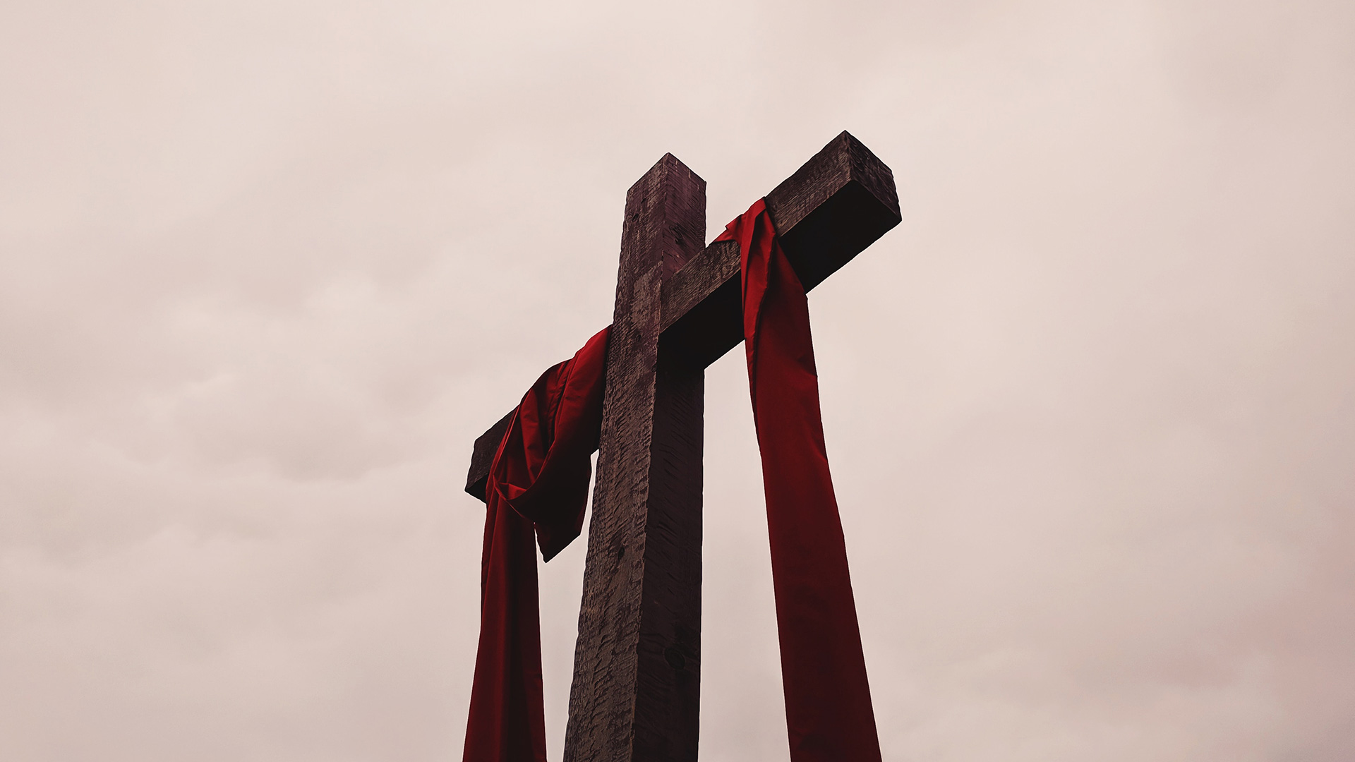 low-angle-view-of-cross-with-red-garment