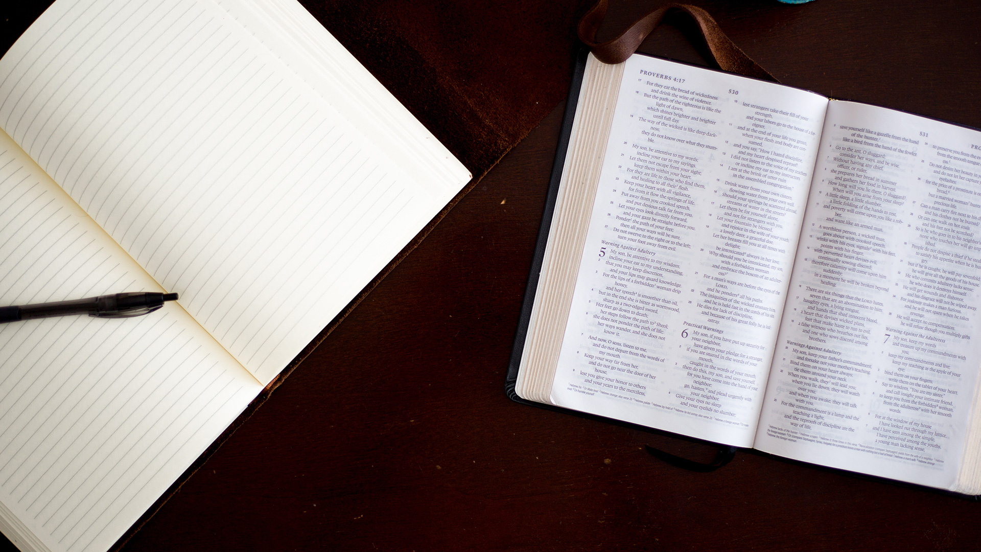 black-click-pen-on-white-notebook-Proverbs