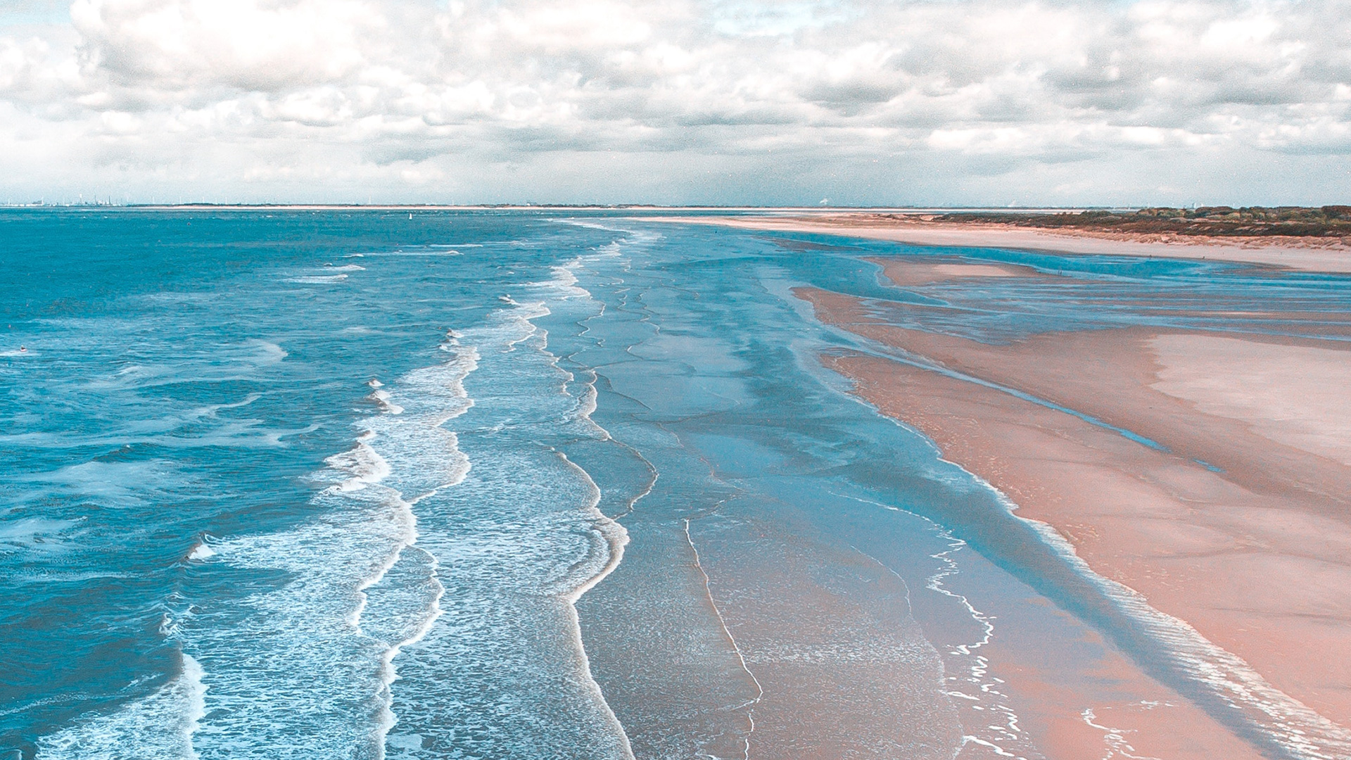 landscape-photo-of-seashore-under-cloudy-sky-during-daytime