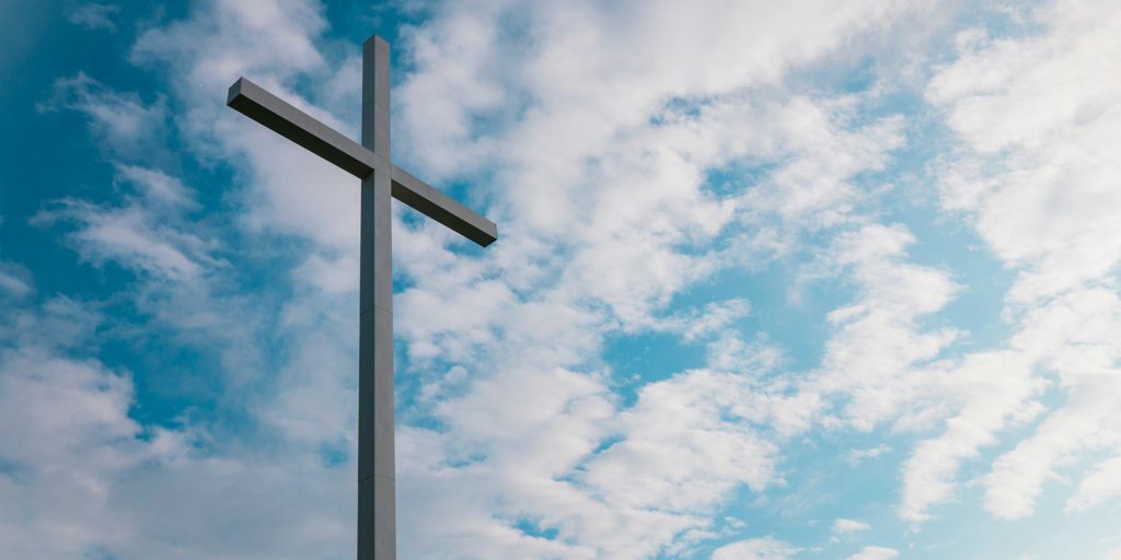 landscape-shot-of-white-cross-during-daytime