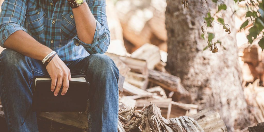 man-wearing-blue-plaid-shirt-and-blue-jeans