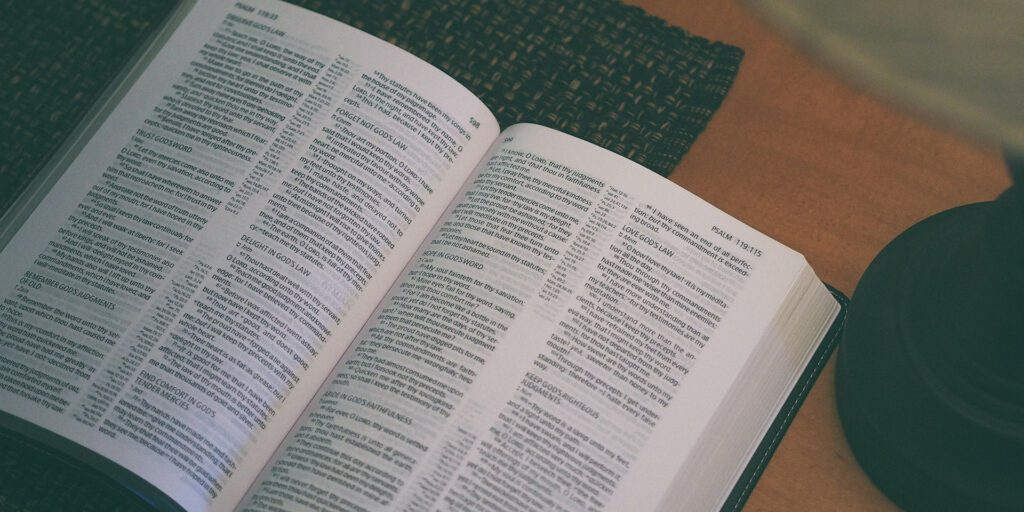 white-book-beside-black-table-lamp-Psalm-119